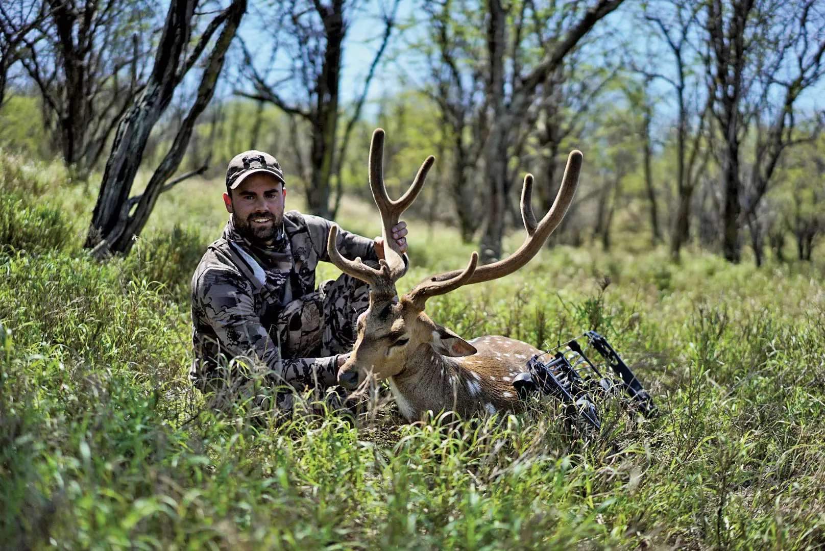 Remi with an axis buck taken on a hawaiian exotic hunt.