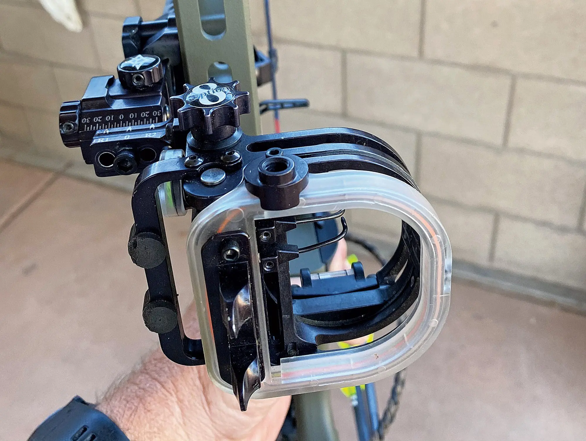 A bow sight attached to a Mathews VXR