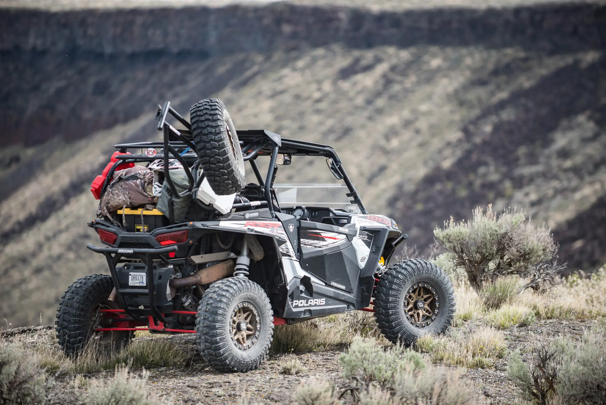 A UTV loaded down for hunting.