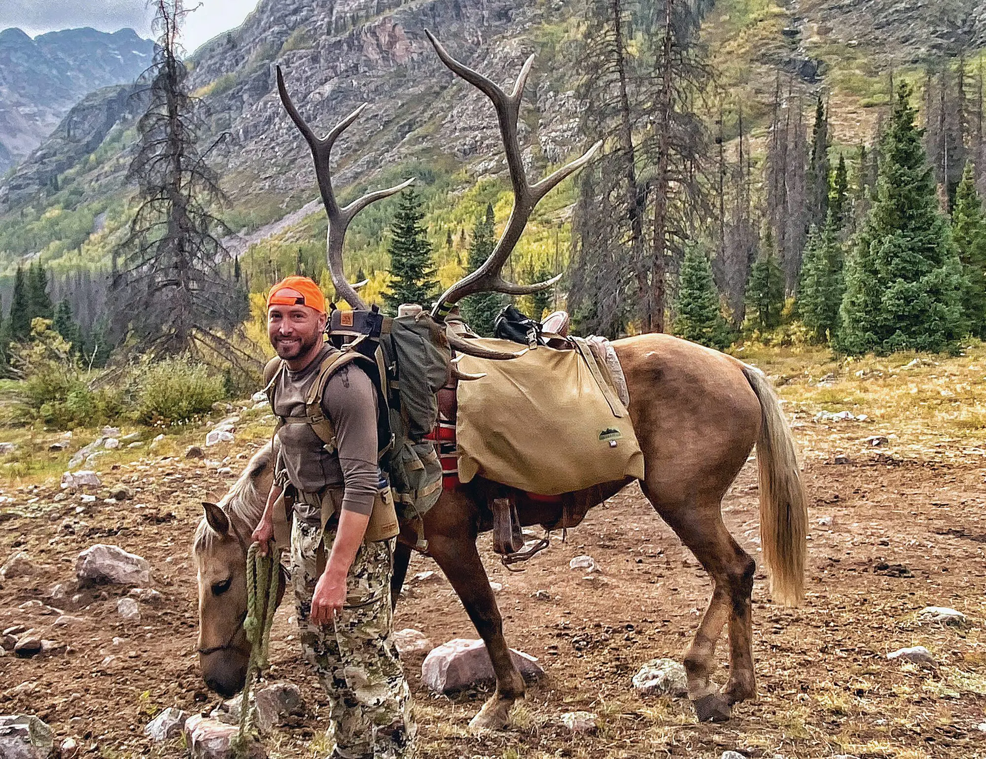 The author’s friend, Jaron, with a mature 6 point bull killed 22 miles from the trailhead.