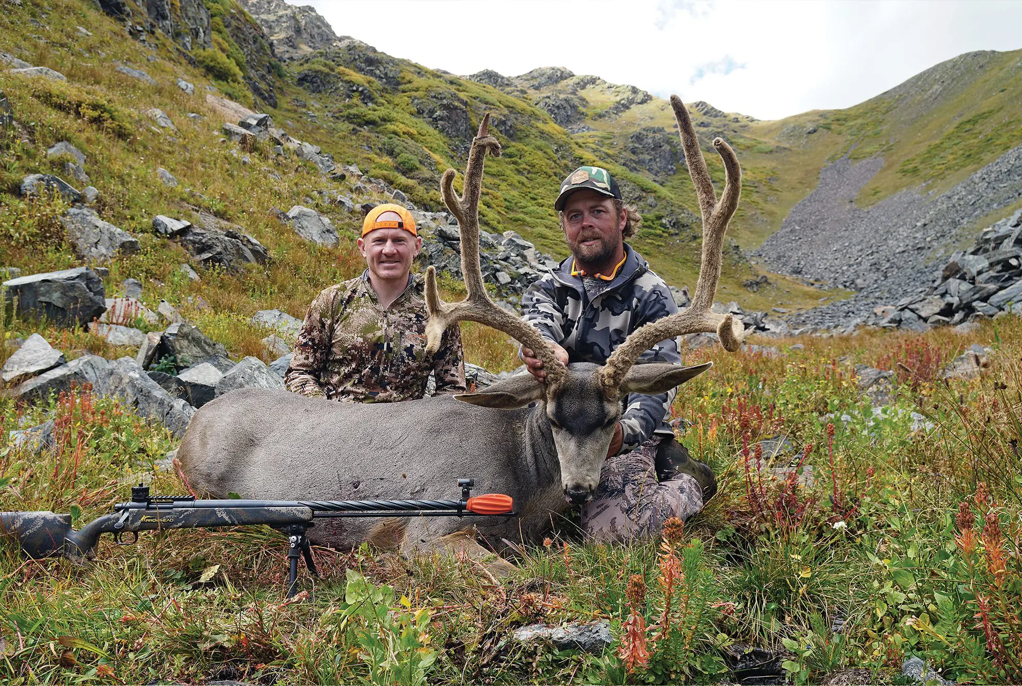 The author and his hunting partner with a big buck, killed on a left over tag 16 miles from the trailhead.