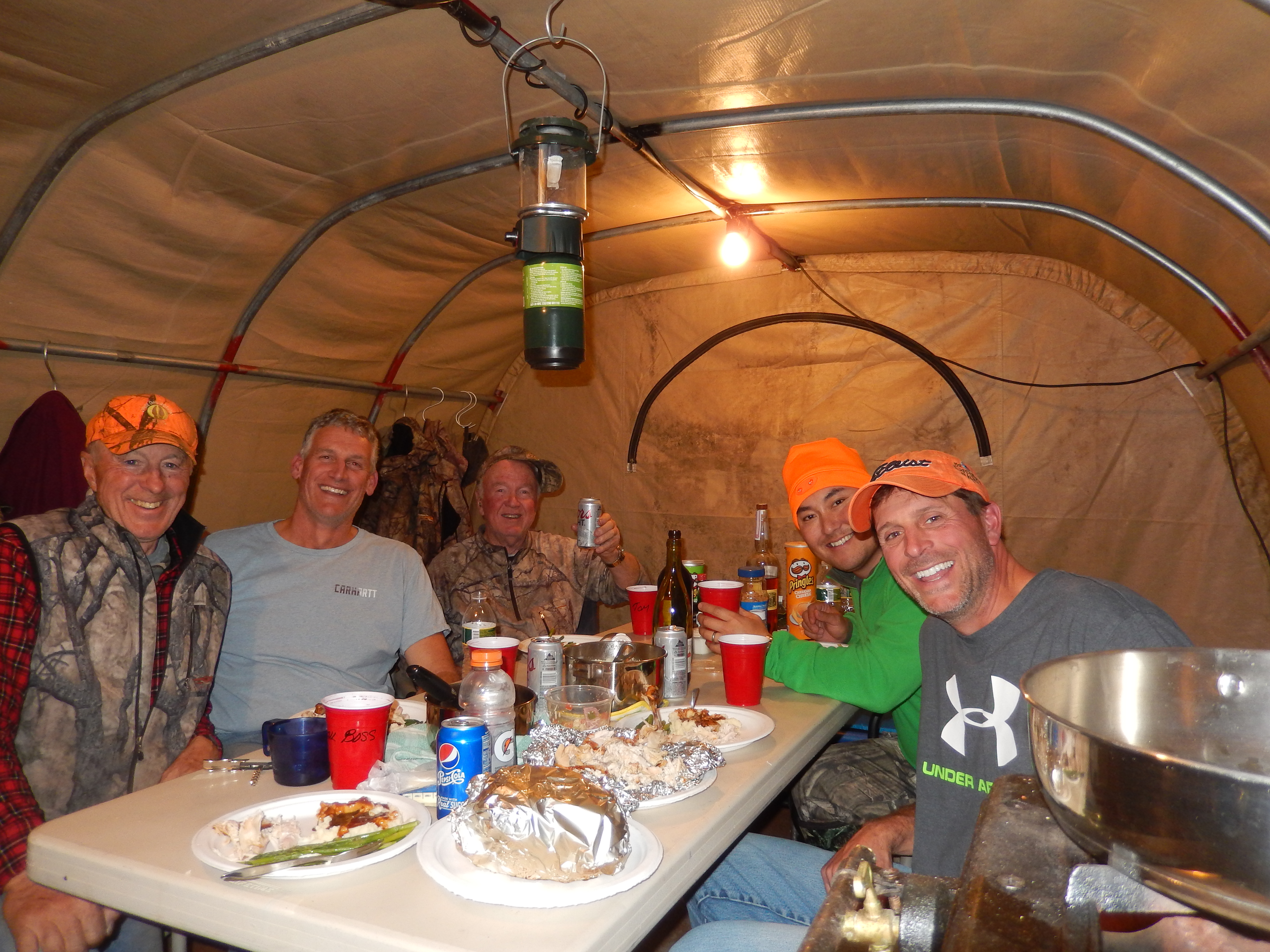 George Bettas and a group of friends enjoying a backcountry meal.