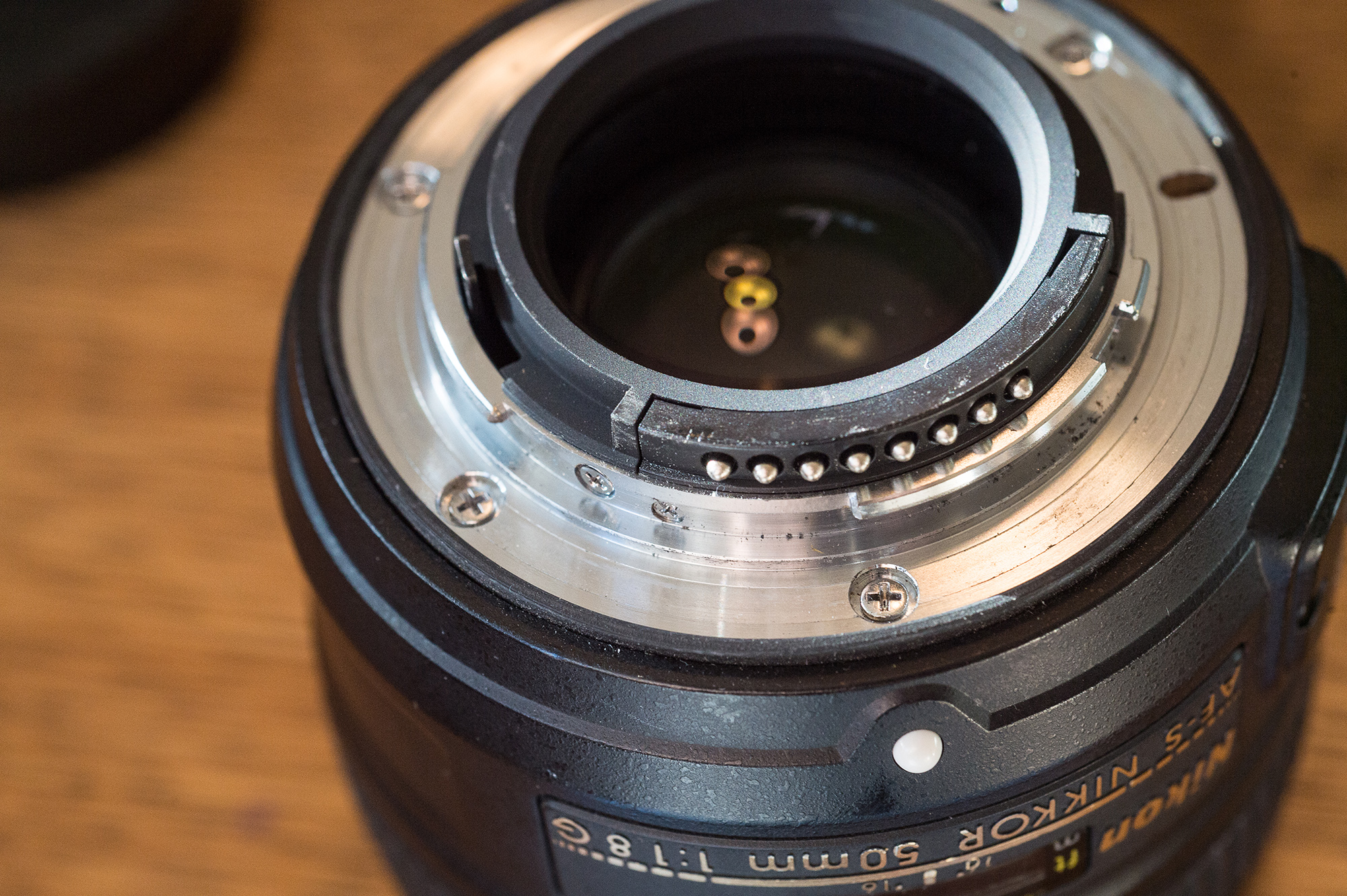 clean the back of the lens for proper camera lens care