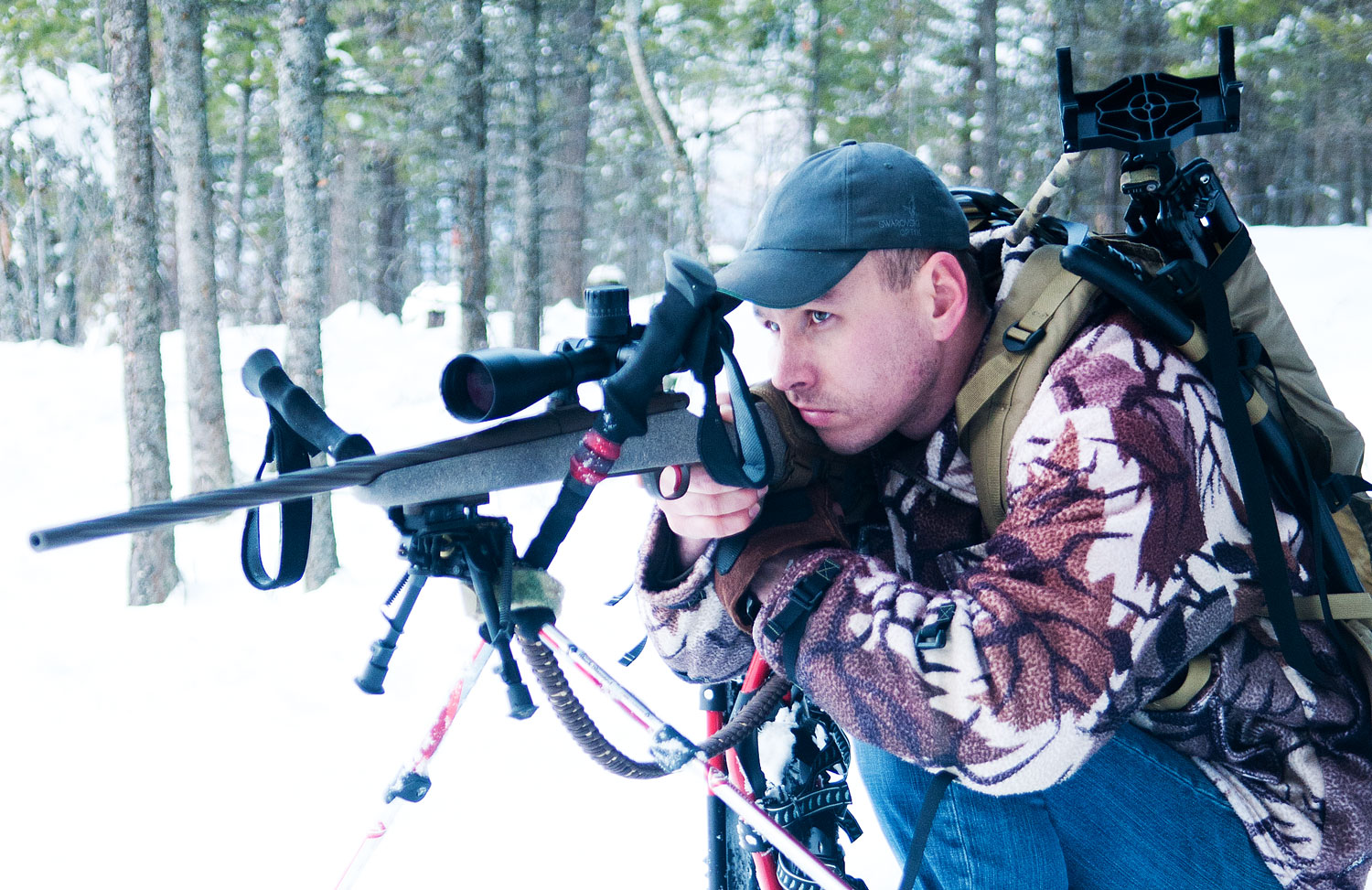 Colton Bagnoli setting up an improvised rifle shot on trekking poles.