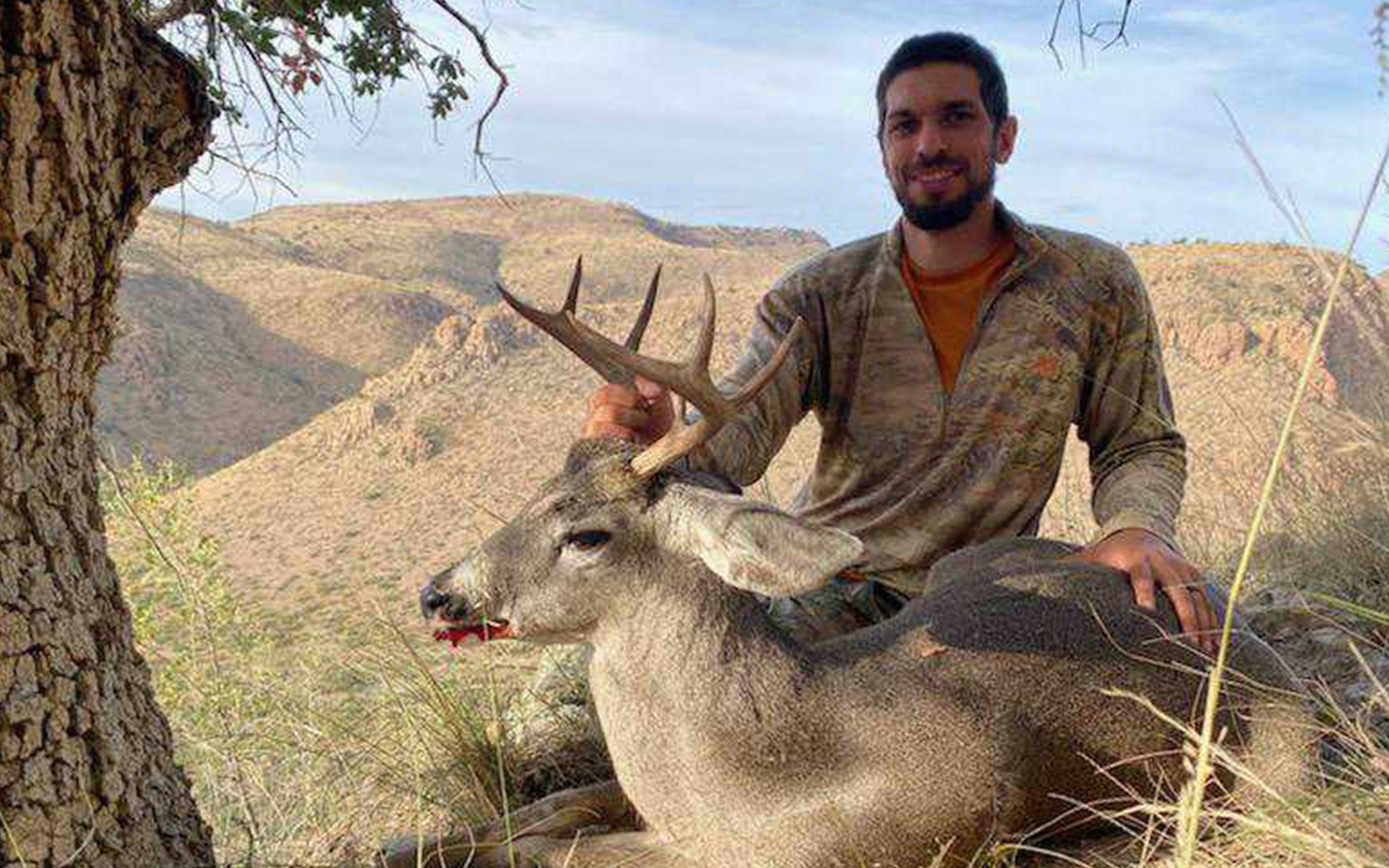Doug with his coues deer after some long-range shooting