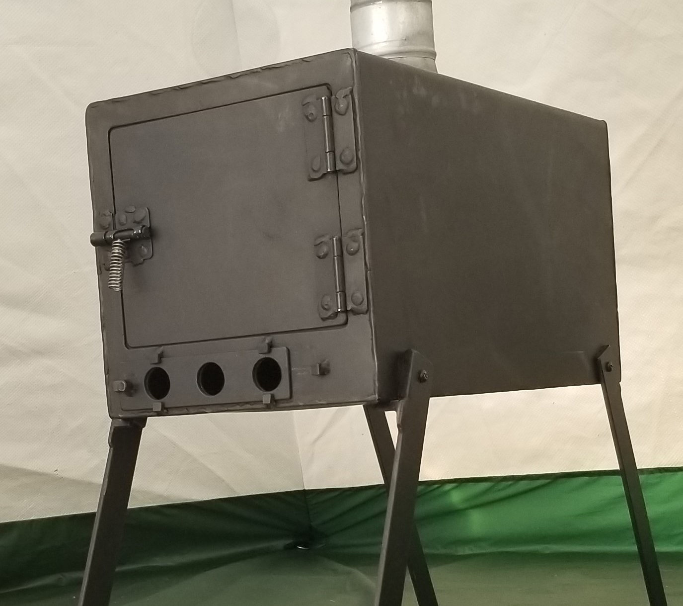 a good looking stove in a tent