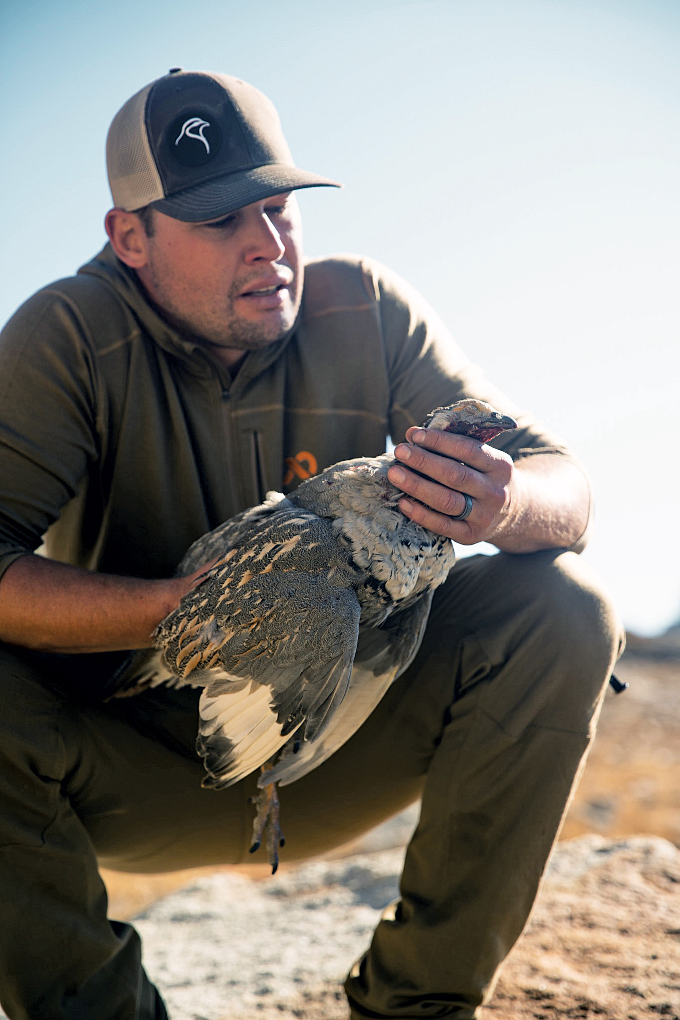 Travis Warren with a Himalayan Snowcock taken in a Nevada.