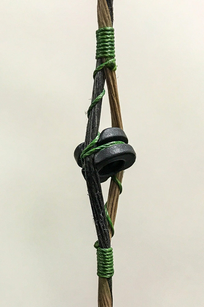 a properly tied in peep sight on a compound bow setup