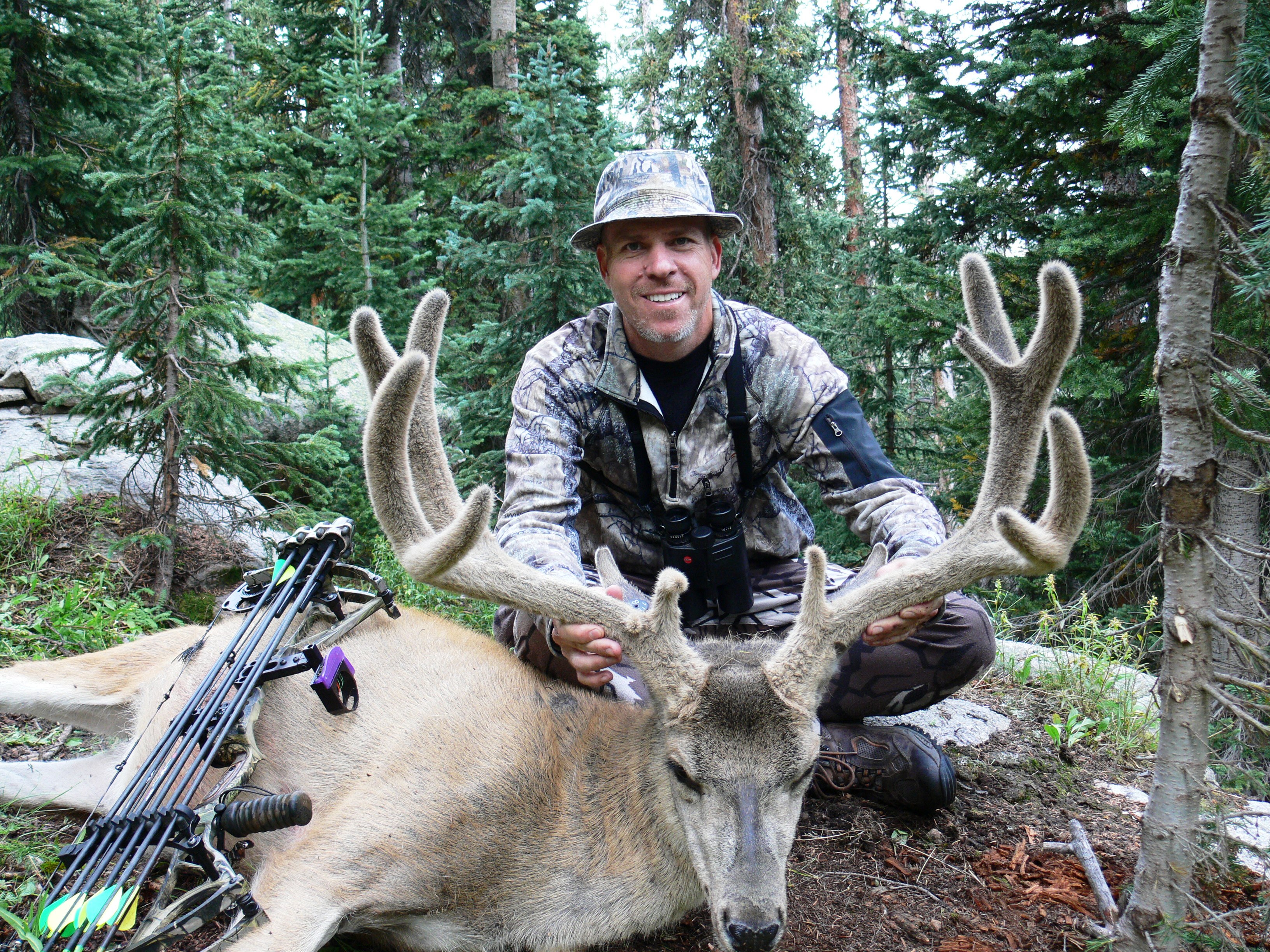 Roy Crace with a nice mule deer buck in velvet while bowhunting.
