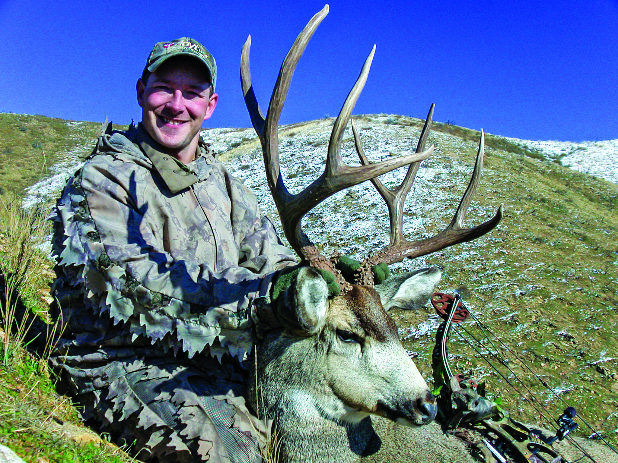 Darin Cooper with a successful archery mule deer