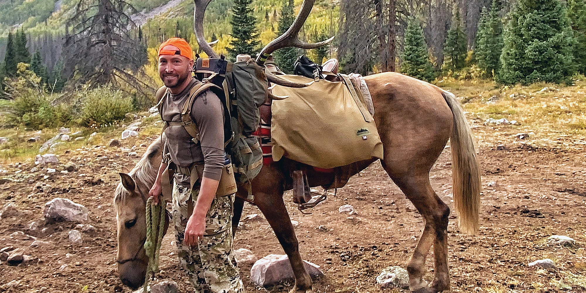 the author's friend, Jaron, with a mature 6-point bull killed 22 miles from the trailhead.